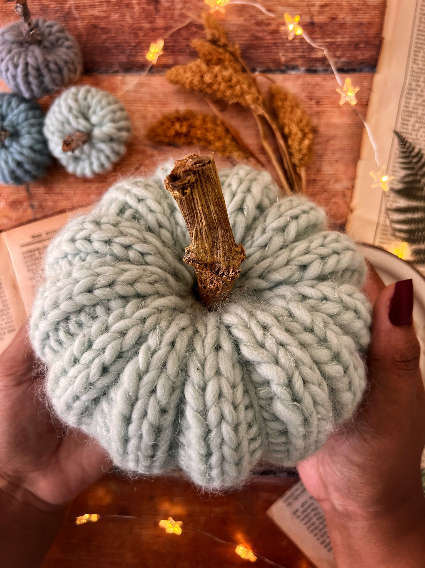 Small knitted pumpkin pale mint with gold stalk