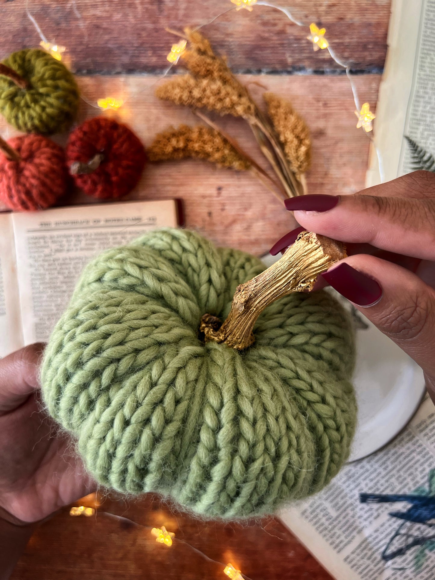 Little knitted pumpkin green meadow with gold stalk