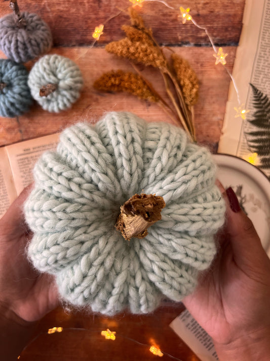 Small knitted pumpkin pale mint with gold stalk