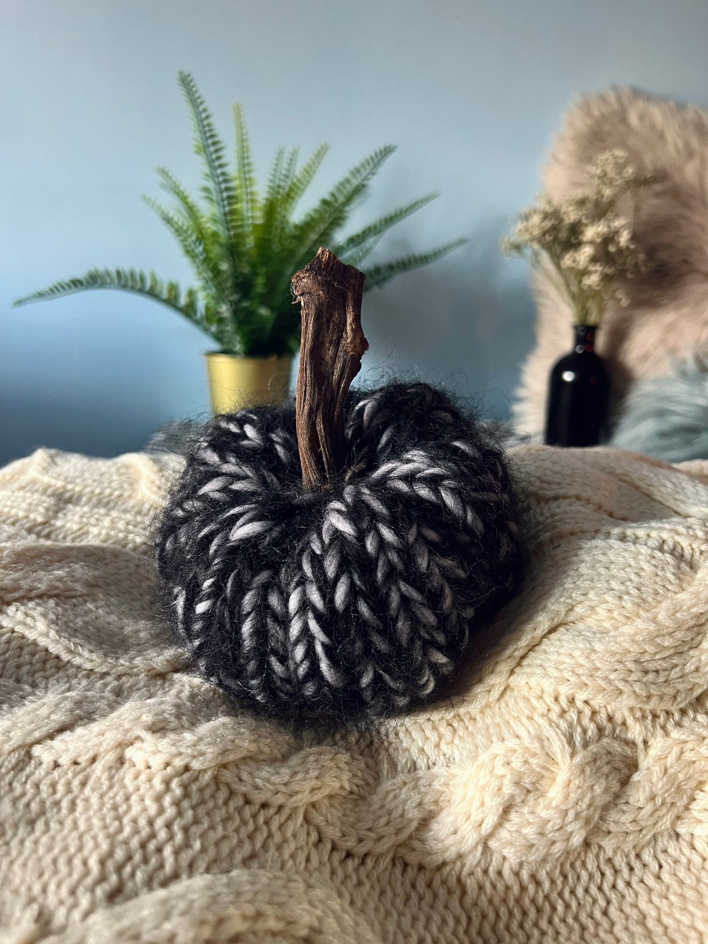 Tiny black and grey mohair knitted pumpkin